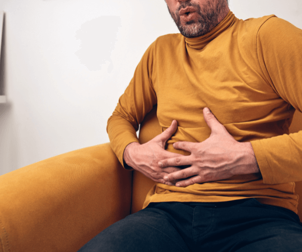 Man with digestive discomfort